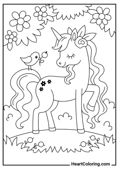 Coloriage PDF gratuit : Licorne dans une prairie