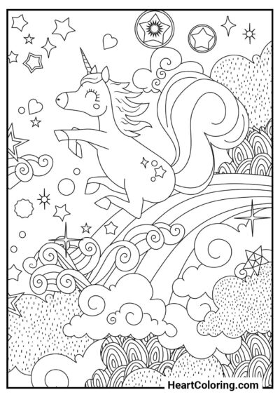 Licorne joyeuse glissant sur un arc-en-ciel — coloriage gratuit à imprimer