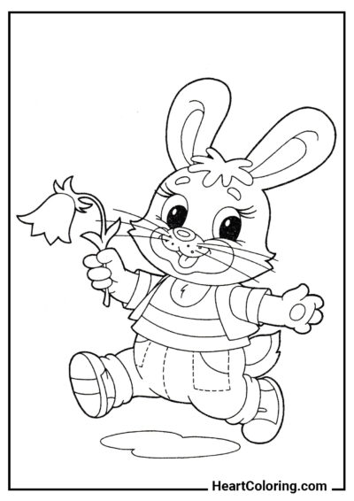 Conejito alegre con una flor - Dibujos de Conejos para Colorear